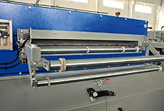 Granulator with roller feeding system